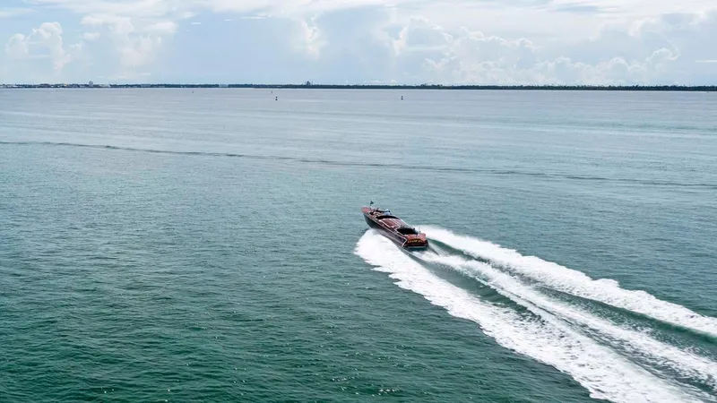 Slide: The Image of Custom Hugh Saint 34 Grand Prix boat cruising on open water, 1995 model. - 16