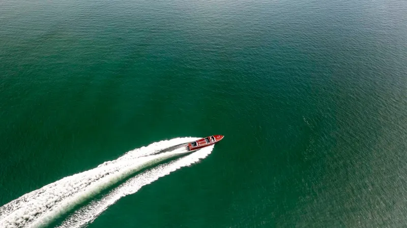 Slide: The Image of Aerial view of 1995 Custom Hugh Saint 34 Grand Prix speedboat on open water. - 17