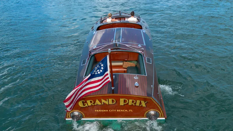 Slide: The Image of Classic 1995 Hugh Saint 34 Grand Prix boat cruising with American flag, Panama City Beach, FL. - 21