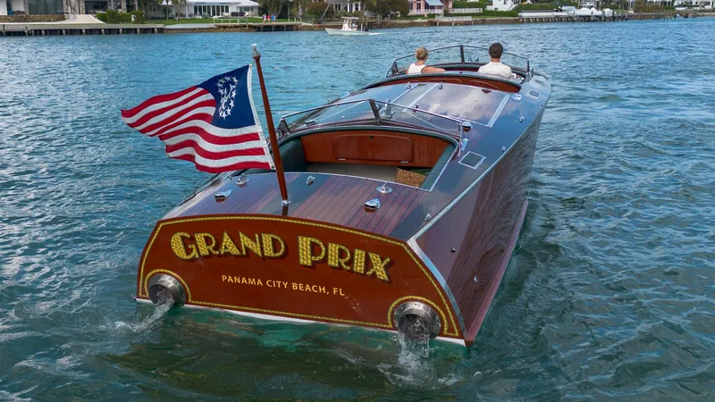 Slide: The Image of Custom 1995 Hugh Saint 34 Grand Prix boat on water, American flag, Panama City Beach. - 22