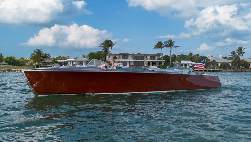 Slide: The Image of Custom 1995 Hugh Saint 34 Grand Prix boat on water, with scenic waterfront background. - 26