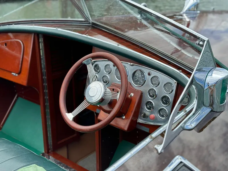Slide: The Image of Interior of a 1995 Custom Hugh Saint 34 Grand Prix boat with vintage steering wheel and dashboard. - 30