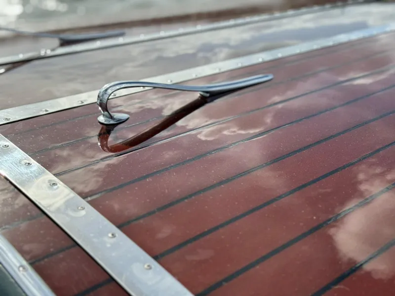 Slide: The Image of Polished wood deck of 1995 Custom Hugh Saint 34 Grand Prix boat. - 32