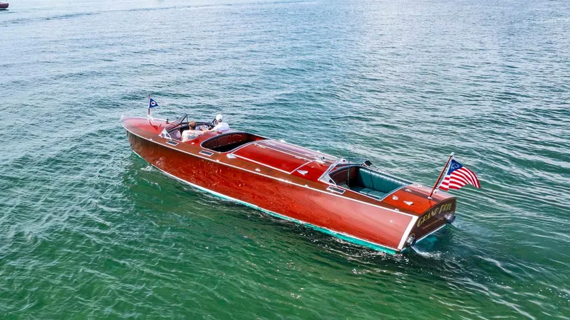 Slide: The Image of Custom 1995 Hugh Saint 34 Grand Prix boat cruising on open water. - 4