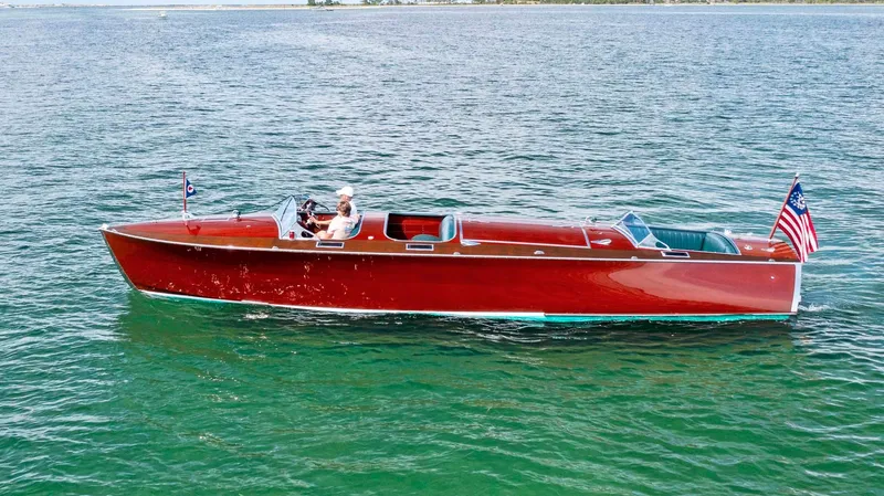 Slide: The Image of Classic 1995 Hugh Saint 34 Grand Prix boat cruising on open water. - 6