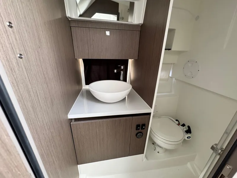 Slide: The Image of 2024 Beneteau Flyer 9 SUNdeck bathroom with modern sink and toilet. - 22