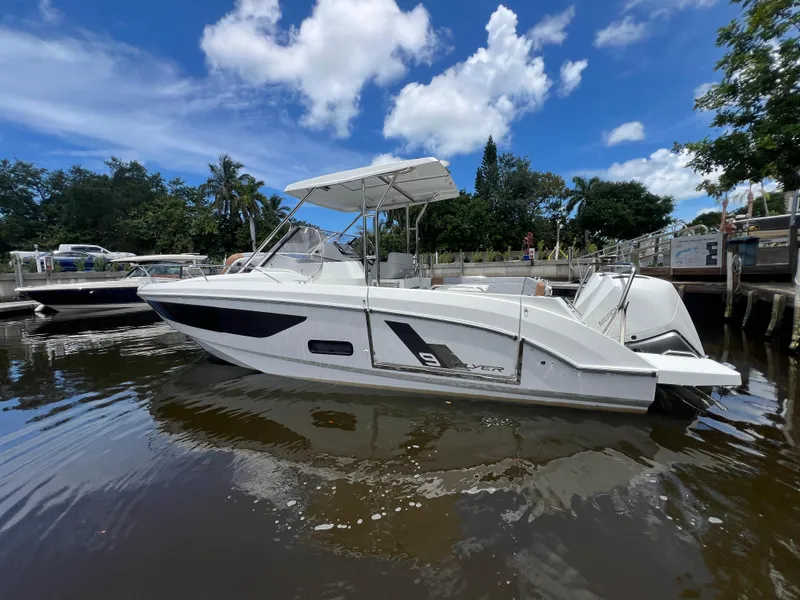 Slide: The Image of 2025 Beneteau Flyer 9 SUNdeck boat docked on a sunny day. - 3