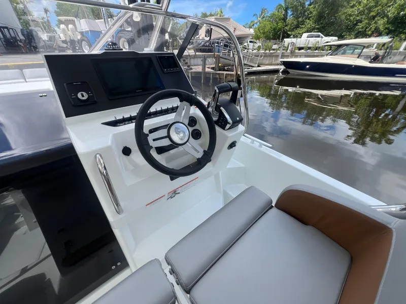 Slide: The Image of 2025 Beneteau Flyer 9 SUNdeck helm with modern controls and comfortable seating. - 9