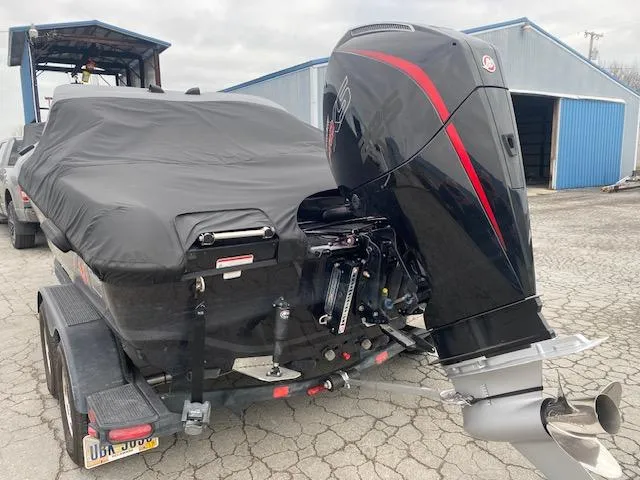 Slide: The Image of 2023 Nitro ZV19 Pro boat with cover and powerful outboard motor. - 11