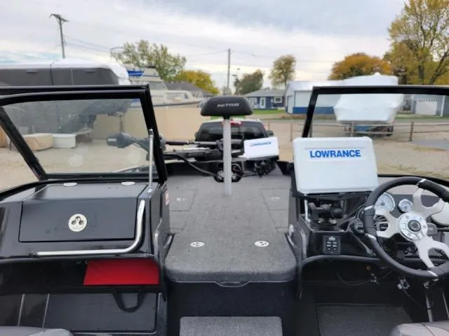 Slide: The Image of 2023 Nitro ZV19 Pro boat interior with Lowrance electronics and steering wheel. - 6