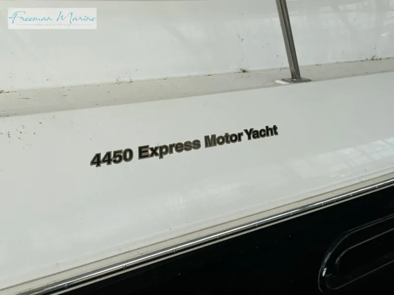 Slide: The Image of 2001 Cruisers Yachts 4450 Express Motoryacht nameplate on white surface. - 25