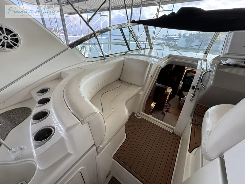 Slide: The Image of 2001 Cruisers Yachts 4450 Express Motoryacht interior with white seating and wood flooring. - 28