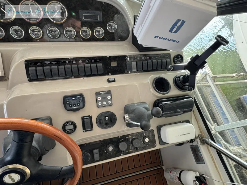 Slide: The Image of Control panel of 2001 Cruisers Yachts 4450 Express Motoryacht with navigation instruments. - 33