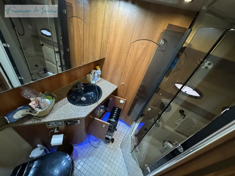 Slide: The Image of Luxurious bathroom in 2001 Cruisers Yachts 4450 Express Motoryacht with modern amenities. - 36