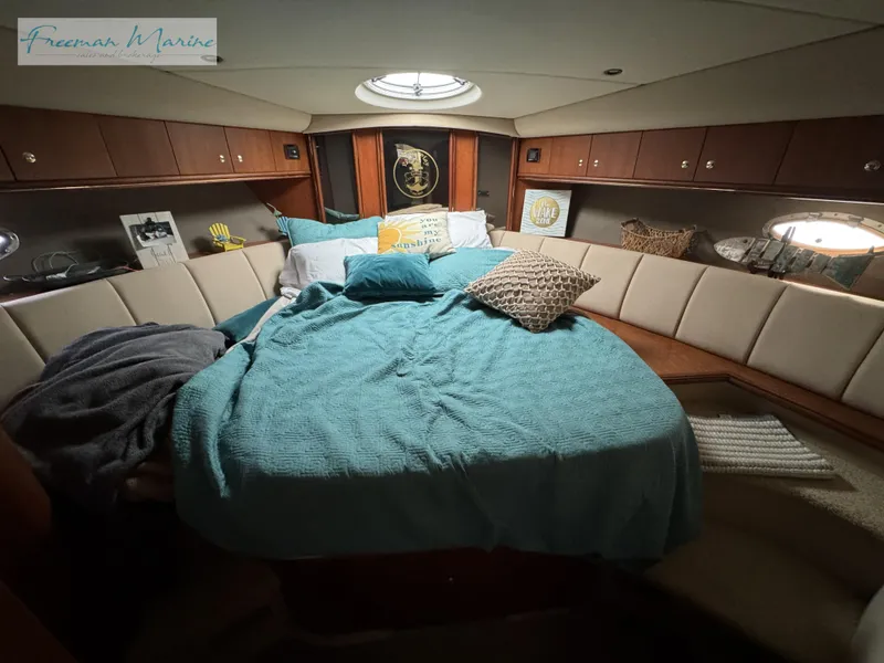 Slide: The Image of Luxurious 2001 Cruisers Yachts 4450 Express Motoryacht bedroom with cozy bedding and elegant decor. - 38