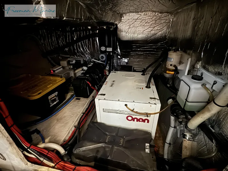 Slide: The Image of Engine room of 2001 Cruisers Yachts 4450 Express Motoryacht with Onan generator. - 40