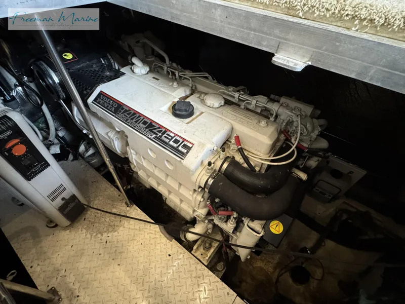 Slide: The Image of Engine room of 2001 Cruisers Yachts 4450 Express Motoryacht, featuring a powerful engine. - 43