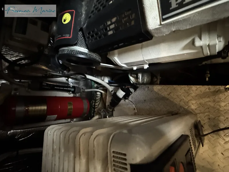 Slide: The Image of Engine room of 2001 Cruisers Yachts 4450 Express Motoryacht with equipment and fire extinguisher. - 44