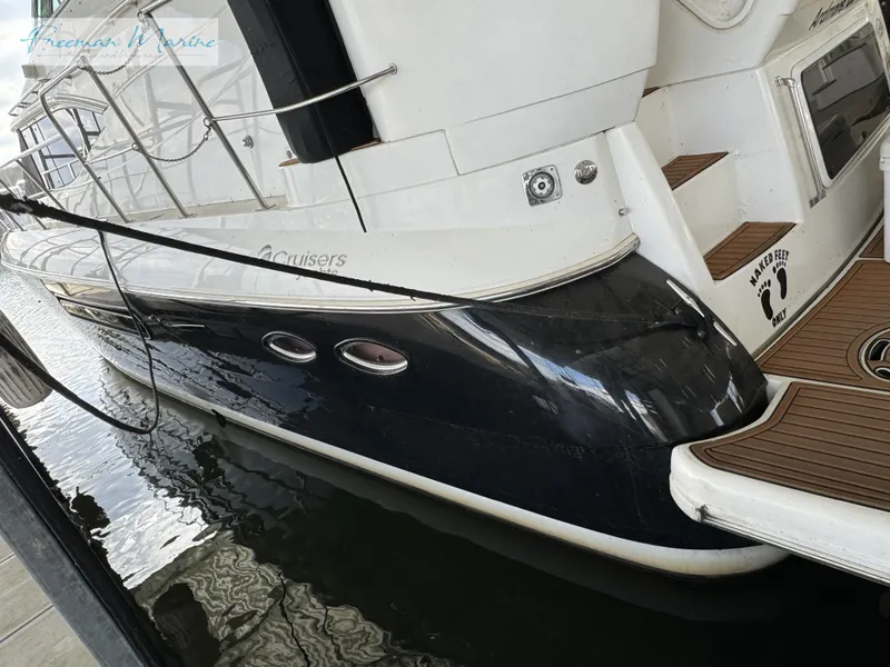 Slide: The Image of 2001 Cruisers Yachts 4450 Express Motoryacht docked, showcasing sleek design and modern features. - 18