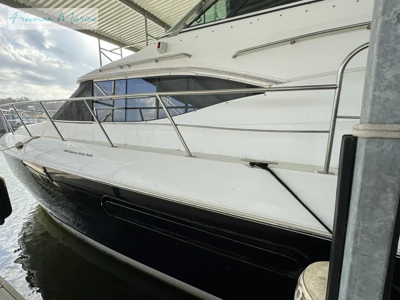 Slide: The Image of 2001 Cruisers Yachts 4450 Express Motoryacht docked in marina. - 20