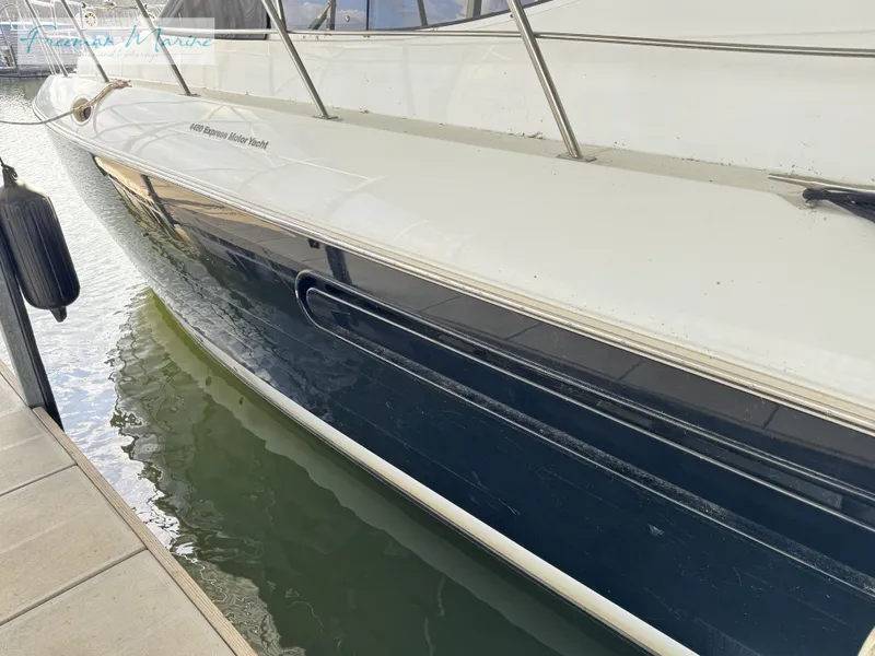 Slide: The Image of 2001 Cruisers Yachts 4450 Express Motoryacht docked in marina. - 21