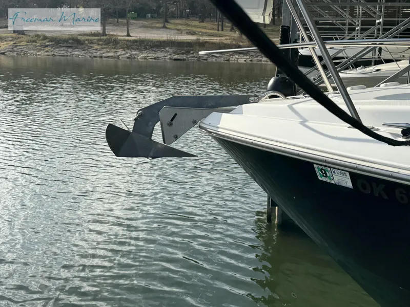 Slide: The Image of 2001 Cruisers Yachts 4450 Express Motoryacht anchored in calm waters. - 24