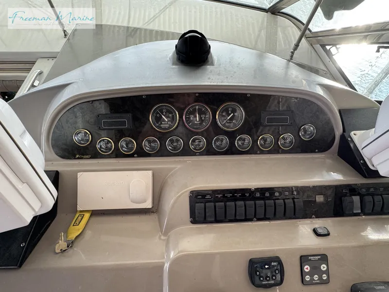 Slide: The Image of Dashboard of 2001 Cruisers Yachts 4450 Express Motoryacht with gauges and controls. - 32