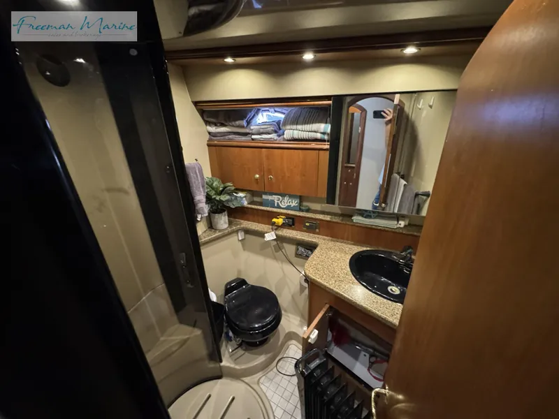 Slide: The Image of Luxurious bathroom in 2001 Cruisers Yachts 4450 Express Motoryacht with modern amenities. - 39