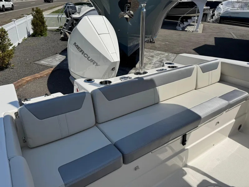 Slide: The Image of 2025 Sailfish 232 CC boat with Mercury engine, featuring comfortable seating and modern design. - 16