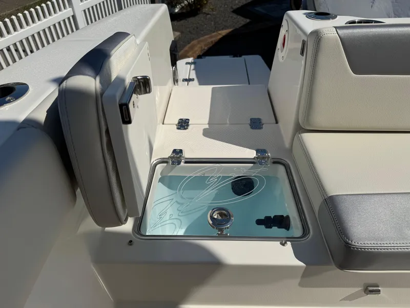 Slide: The Image of 2025 Sailfish 232 CC boat interior with seating and storage compartment. - 22
