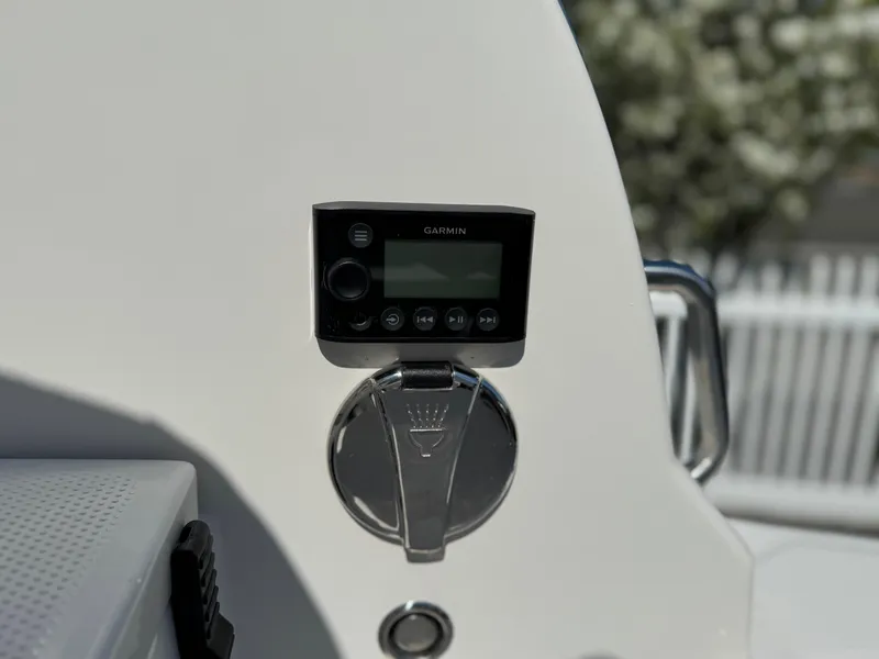 Slide: The Image of Control panel on 2025 Sailfish 232 CC boat, featuring Garmin display. - 24