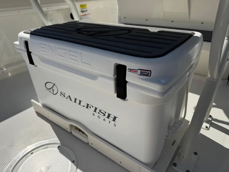 Slide: The Image of Engel cooler on 2025 Sailfish 232 CC boat deck, featuring Sailfish Boats logo. - 28