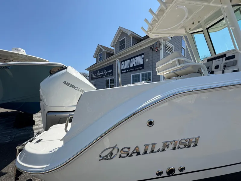 Slide: The Image of 2025 Sailfish 232 CC boat with Mercury engine at a grand opening event. - 3