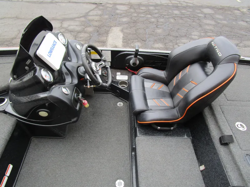 Slide: The Image of 2017 Nitro Z20 Z-Pro boat interior with steering console and cushioned seat. - 21