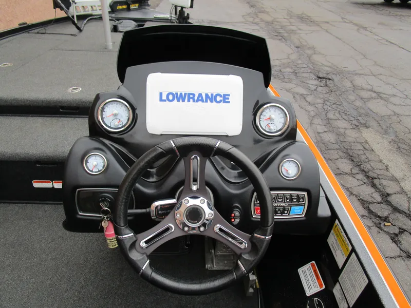 Slide: The Image of 2017 Nitro Z20 Z-Pro boat dashboard with Lowrance display and steering wheel. - 23