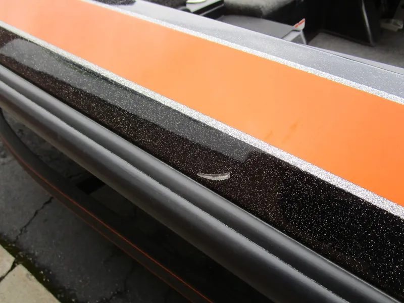 Slide: The Image of Close-up of 2017 Nitro Z20 Z-Pro boat with orange and black detailing. - 9