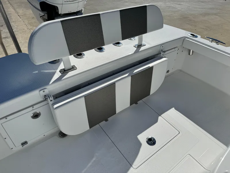 Slide: The Image of 2025 BlackJack 256 Coastal boat seating area with foldable bench and storage. - 11