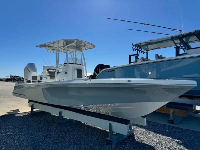 Slide: The Image of 2025 BlackJack 256 Coastal boat displayed outdoors on a sunny day. - 6