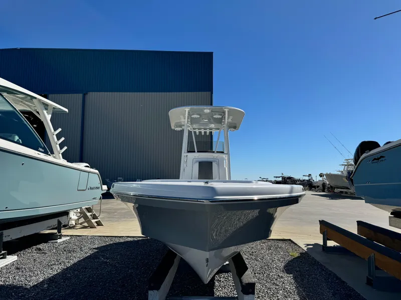 Slide: The Image of 2025 BlackJack 256 Coastal boat displayed outdoors under clear blue sky. - 7