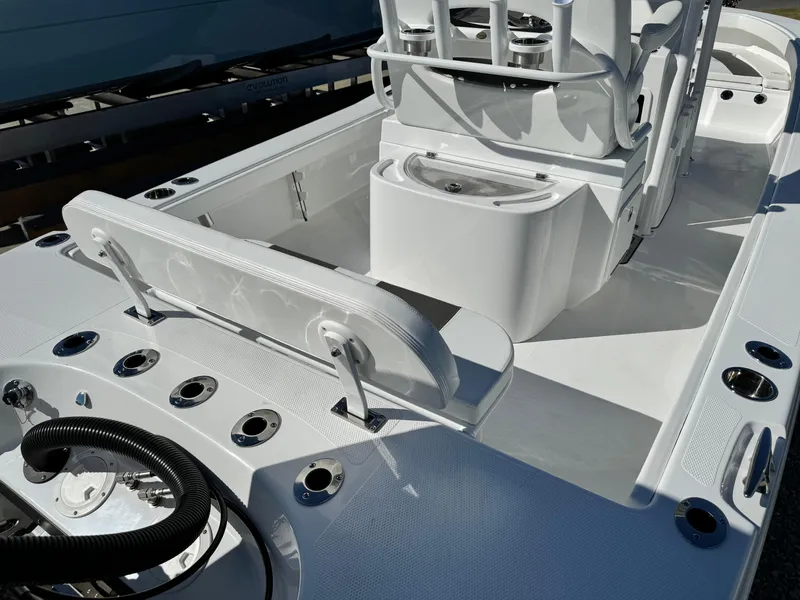 Slide: The Image of 2025 BlackJack 256 Coastal boat interior with seating and rod holders. - 8