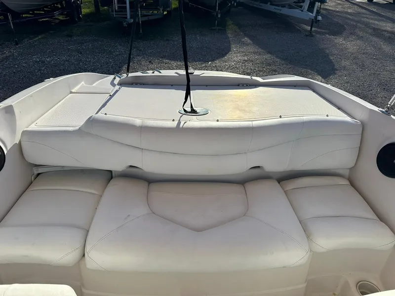 Slide: The Image of 2008 Tahoe Q5i Sport boat interior with white cushioned seating. - 6