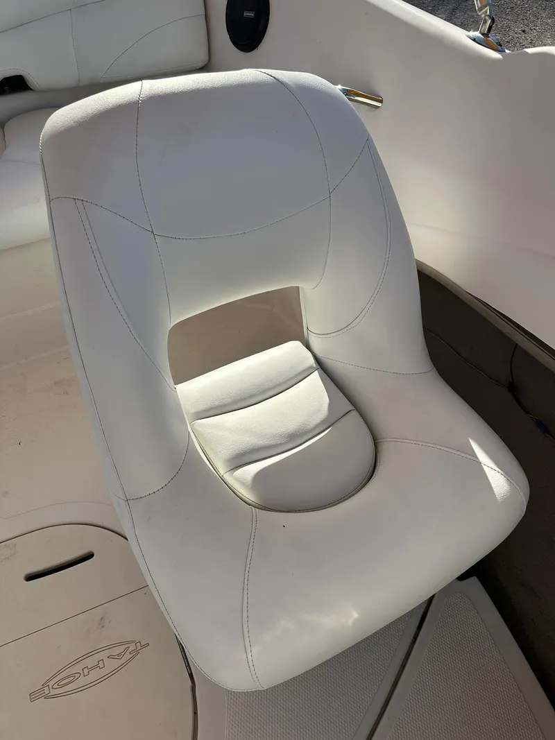 Slide: The Image of White leather seat in a 2008 Tahoe Q5i Sport boat interior. - 9