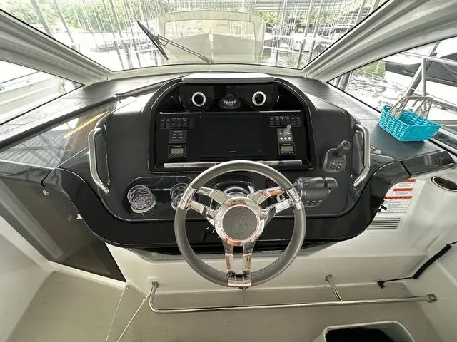 Slide: The Image of 2024 Beneteau Gran Turismo 41 helm with modern controls and sleek design. - 10