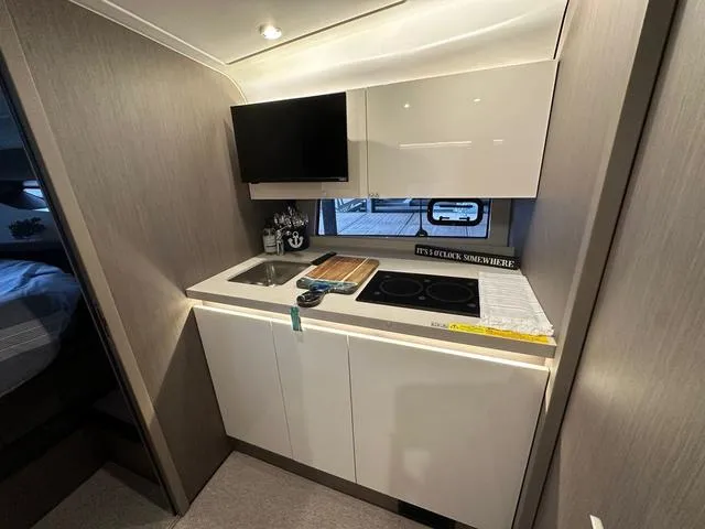 Slide: The Image of 2024 Beneteau Gran Turismo 41 yacht kitchen with modern appliances and sleek design. - 18