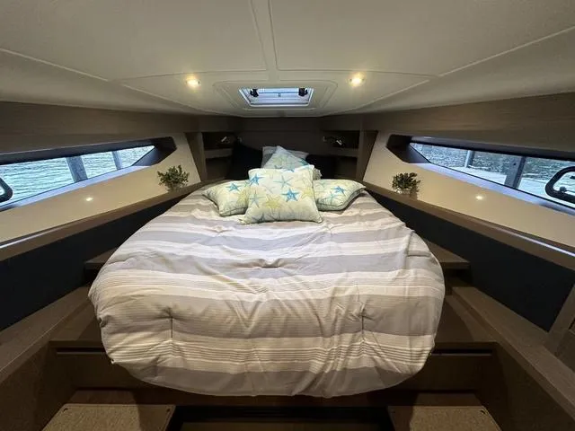 Slide: The Image of Luxurious cabin interior of 2024 Beneteau Gran Turismo 41 yacht with cozy bedding. - 19