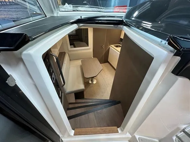 Slide: The Image of 2024 Beneteau Gran Turismo 41 interior cabin with seating and table. - 25