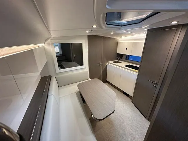 Slide: The Image of Luxurious interior of 2024 Beneteau Gran Turismo 41 yacht with modern kitchen and seating area. - 26