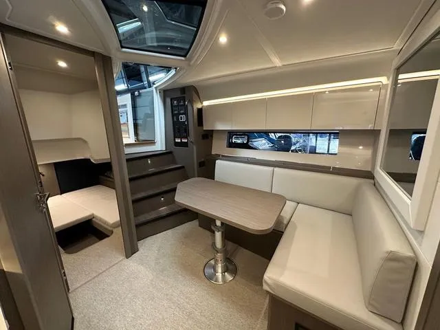 Slide: The Image of Luxurious interior of 2024 Beneteau Gran Turismo 41 yacht with modern seating and table. - 27
