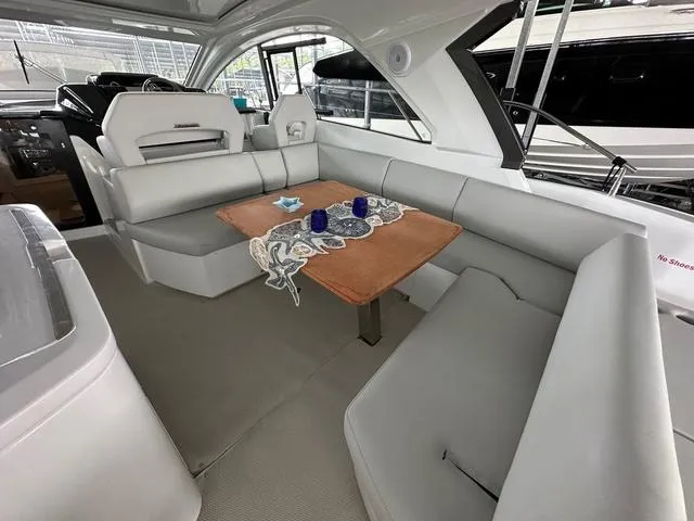 Slide: The Image of Luxurious interior of 2024 Beneteau Gran Turismo 41 yacht with elegant seating and table. - 3
