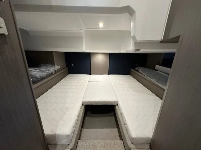 Slide: The Image of 2024 Beneteau Gran Turismo 41 cabin with twin beds and modern design. - 31